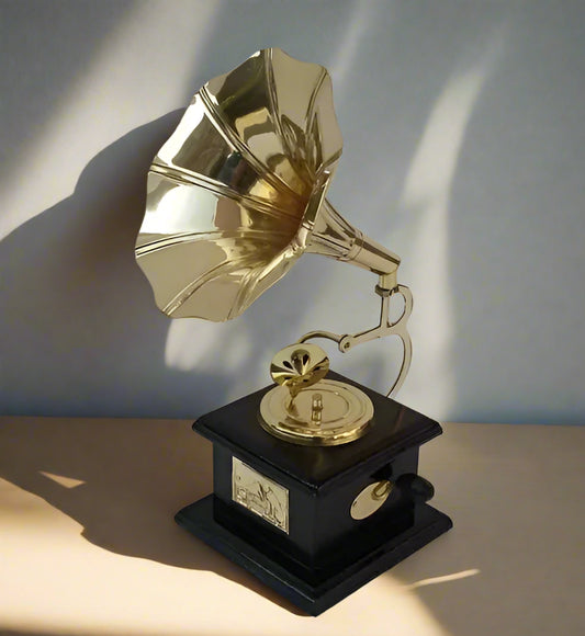 Gold gramophone trophy on a black base against a white background
